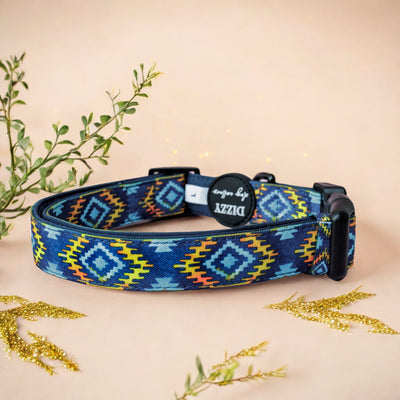 Aztec Empire Dog Collar  Description: This adjustable dog collar features a striking Aztec design in vibrant colours. Made with a combination of canvas and neoprene for comfort and durability, it includes a quick-release buckle and a sturdy D-ring for leash attachment.