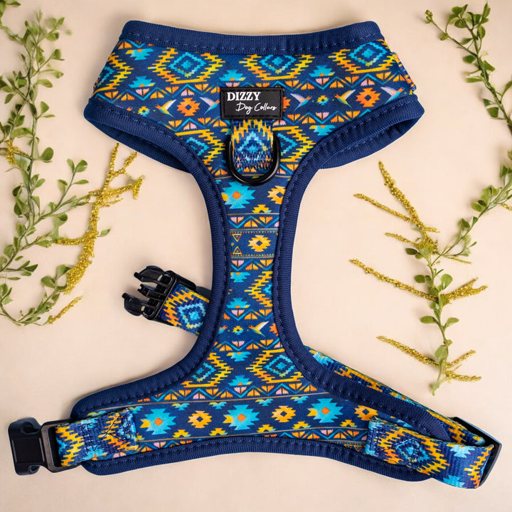 Description: This dog harness features a vibrant Aztec-inspired pattern with bold colors of blue, orange, and green. Made with durable materials, it provides a secure and comfortable fit for your pet. The front D-ring is ideal for leash attachment, ensuring safety during walks.